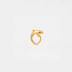 Gold ring with an orca design on a light gray background