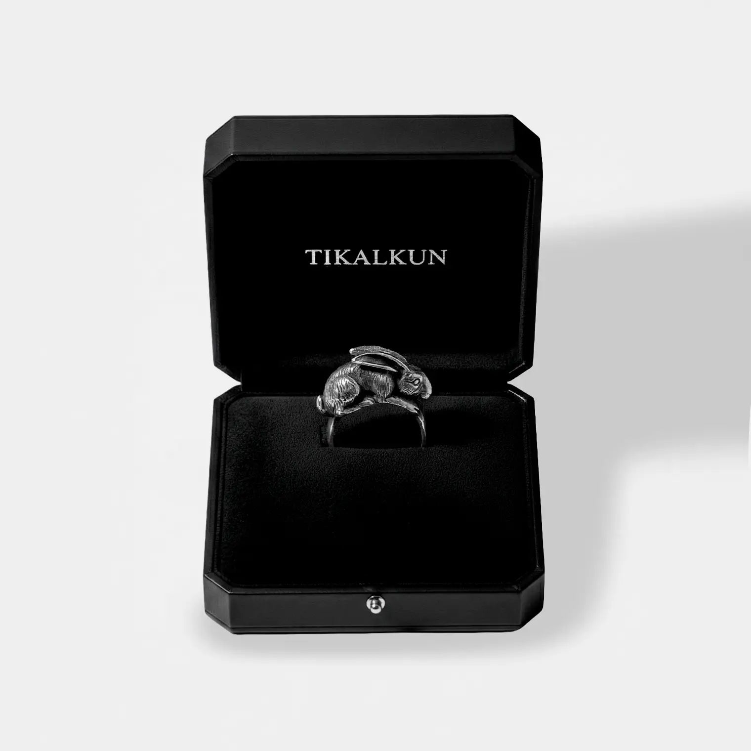 Rabbit Silver ring in a black Tikalkun jewelry box on a light gray background