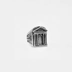 Silver ring with ROMAN architectural design on a white background