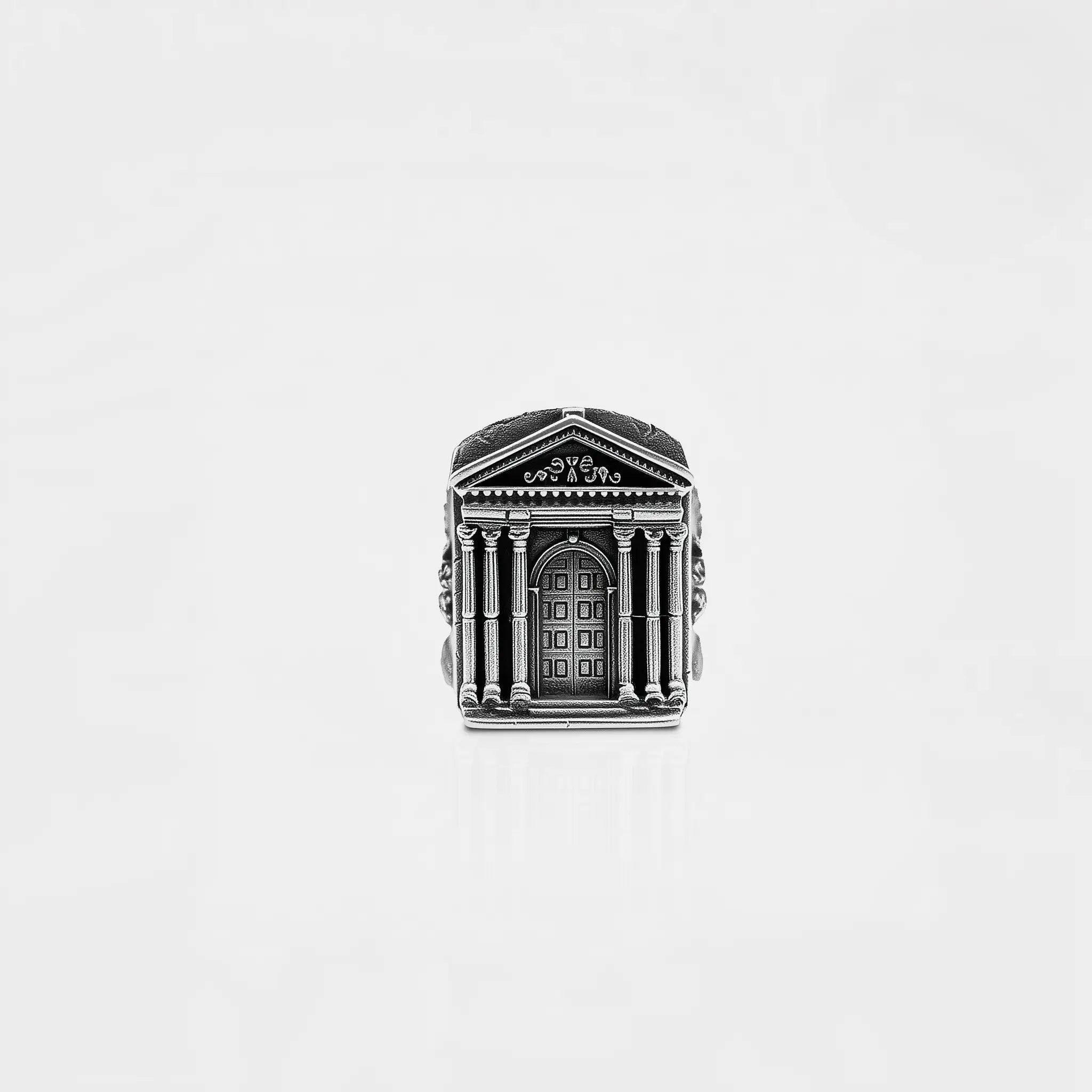 Silver ring with ROMAN architectural design on a white background