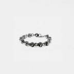 Silver roses bracelet on a light gray background