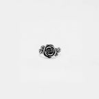 Silver rose-shaped ring on a white background