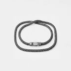 braided chain necklace on a light gray background