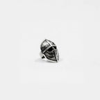 Silver spearman helmet ring on a light gray background