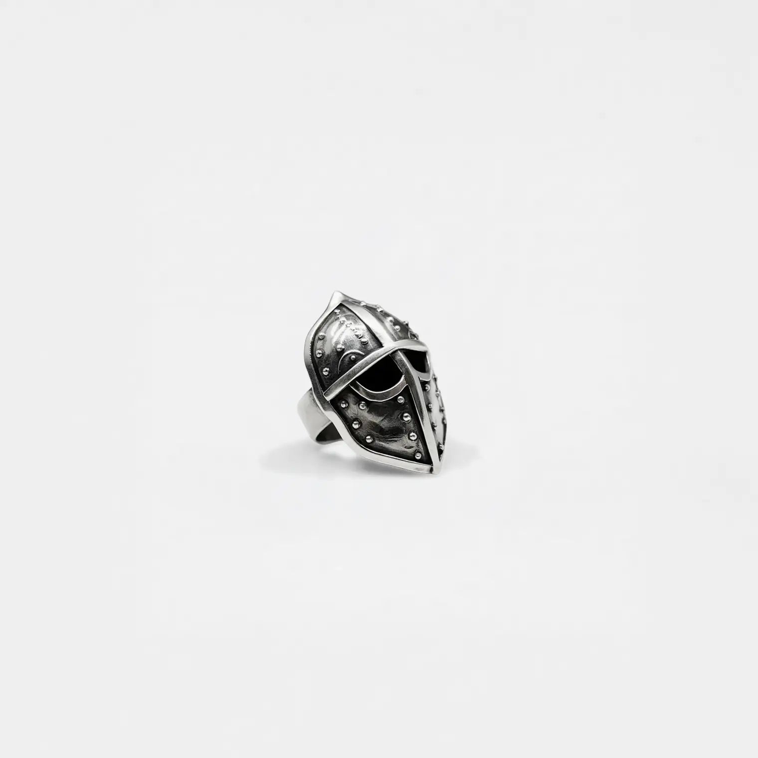 Silver spearman helmet ring on a light gray background
