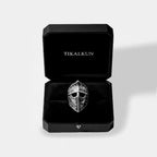 Silver spearman helmet ring in a black box with 'TIKALKUN' branding on a light gray background