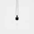 obsidian square pendant necklace on a white background