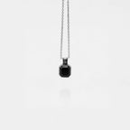 obsidian square pendant necklace on a white background