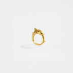 Gold ring with a tiger-shark design on a white background