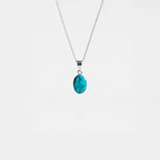 Turquoise pendant necklace on a white background