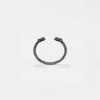 Silver bracelet with quetzalcoatl design on a light gray background