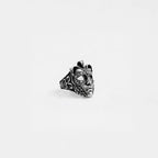 Silver venetian mask ring on a white background