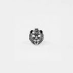 Silver venetian mask ring on a white background