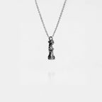 Silver necklace with a venus de milo pendant on a white background