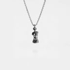Silver necklace with a VENUS DE MILO pendant on a white background