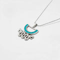 Aztec snake silvernecklace with a turquoise pendant on a white background