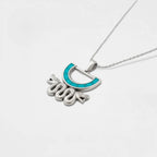 Aztec snake silvernecklace with a turquoise pendant on a white background