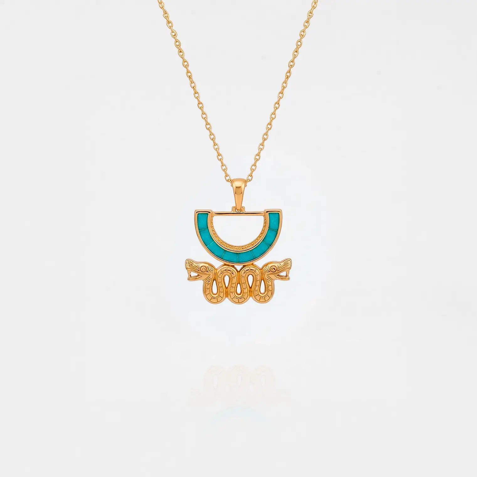 Aztec snake Gold necklace with a turquoise pendant on a white background