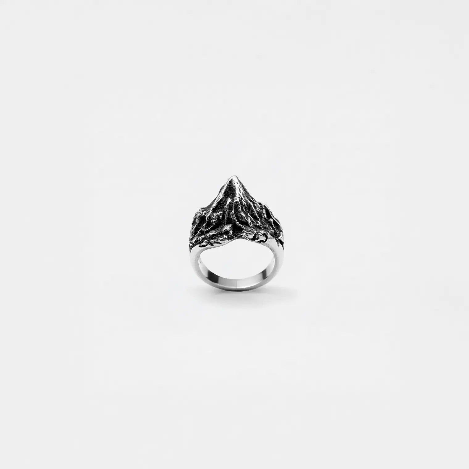 Silver volcano ring on a white background