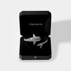 Silver whale-shark bracelet in a black Tikalkun box on a light gray background