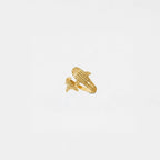 Gold ring shaped like a whale-shark on a light gray background
