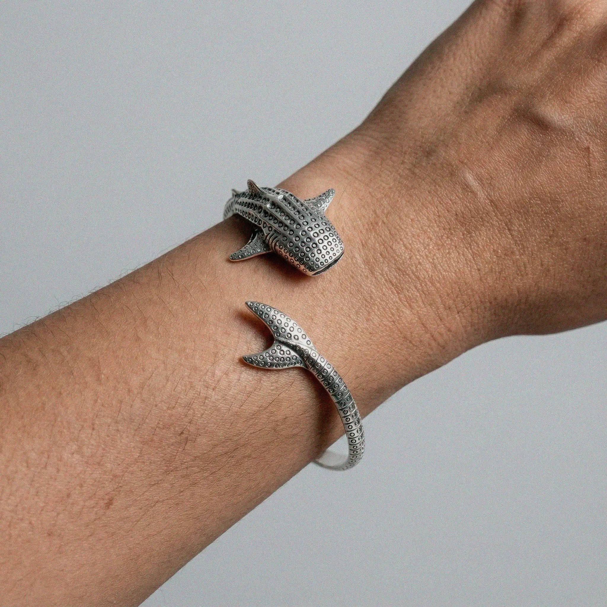 whale shark silver bracelet worn by a person