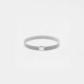 Silver bracelet on a light gray background
