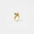 Gold cat ring with sparkling stones on a white background