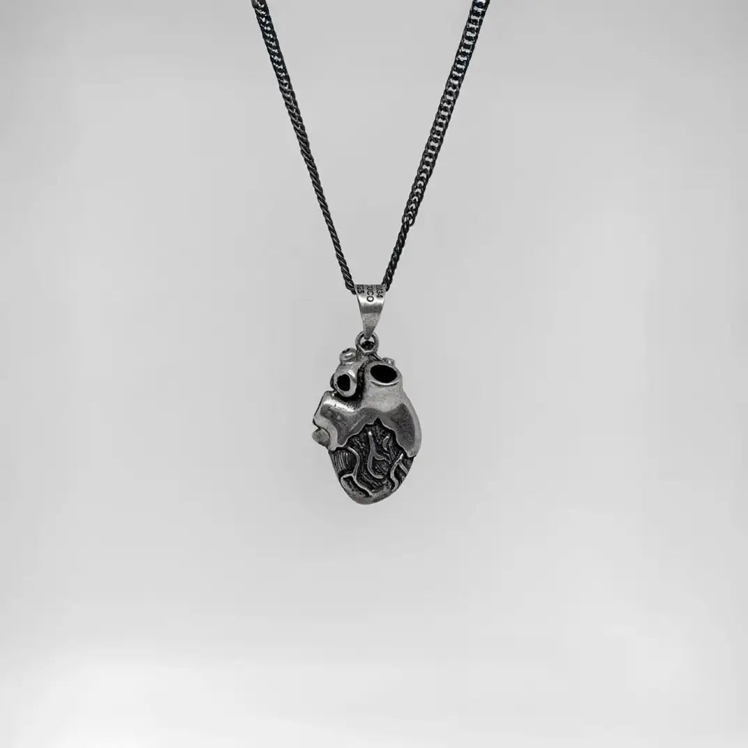 Handcrafted anatomical heart silver pendant, inspired in mayan culture