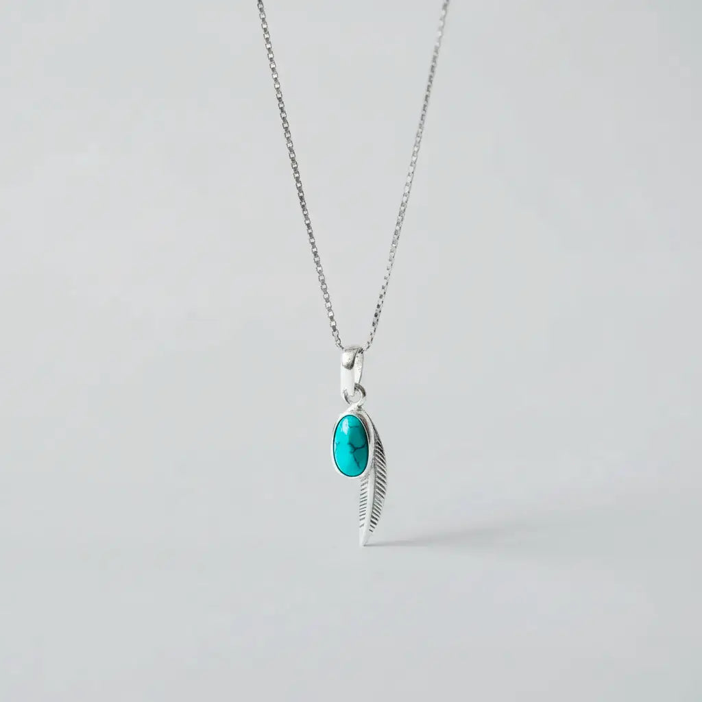 Handcrafted mayan talisman pendant, silver feather pendant with turuqoise 