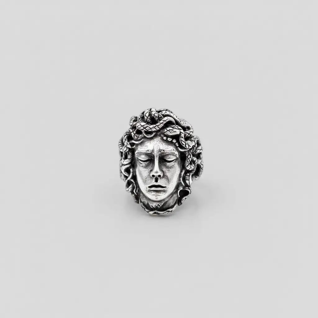 handcrafted medusa silver ring for men on a white background