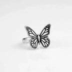 Silver monarch butterfly ring on a black background
