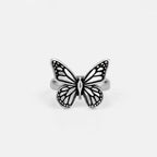 Silver monarch butterfly ring on a black background